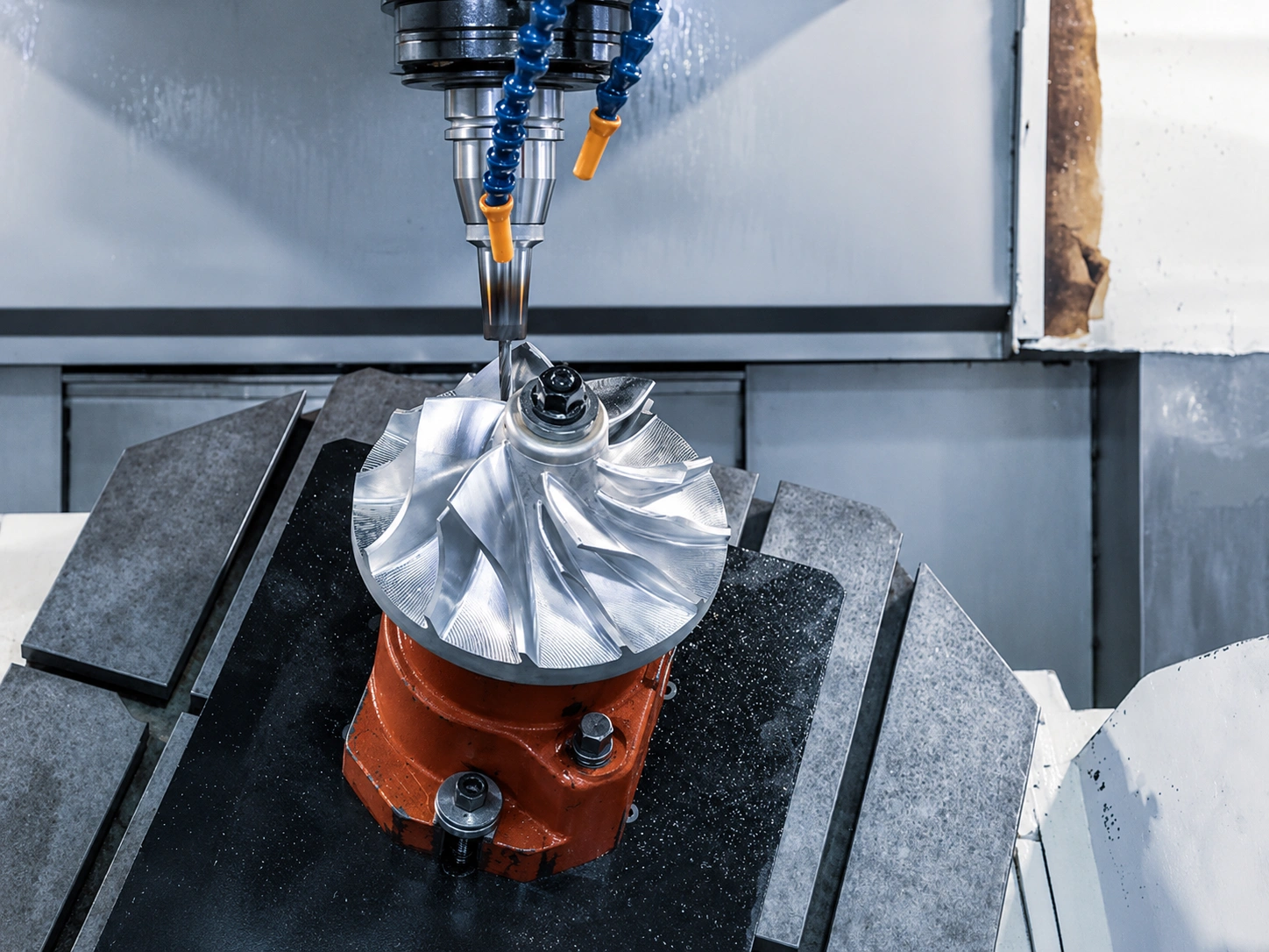 Five-axis CNC machining of a complex turbine impeller