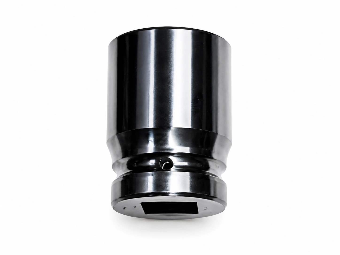 Precision cold-forged polished steel socket component with a cylindrical body and square drive opening on a white background.